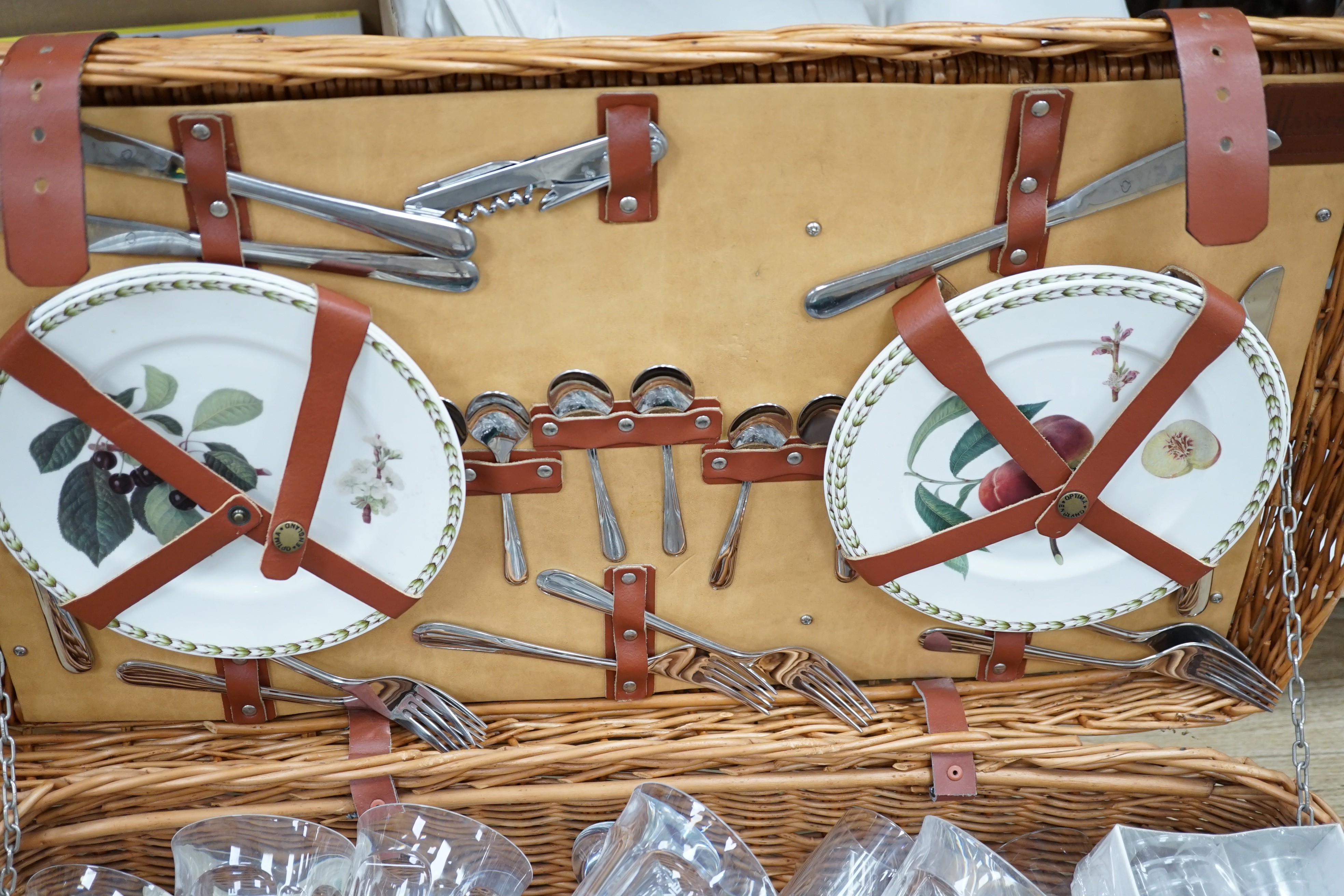 A wicker picnic hamper with assorted Glyndebourne plastic goblets, hamper 72cms wide x 39cms deep